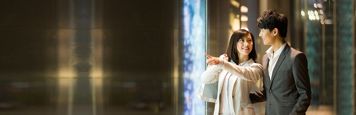 A couple is shopping and smiling. Image used for HSBC Express Banking page.